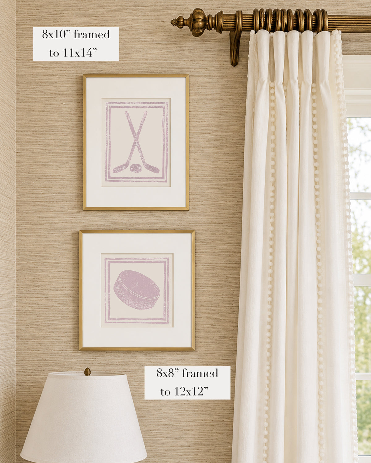 Framed mauve pink and white hockey themed artwork on a tan grasscloth wallpapered wall with a white window treatment and lampshade