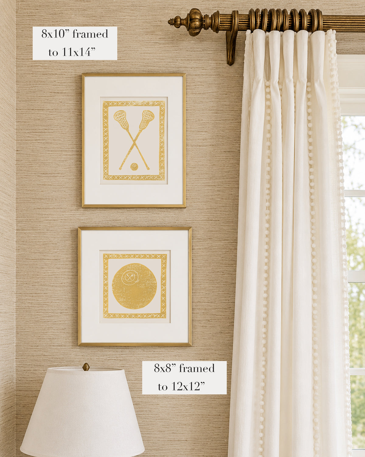 Framed mustard yellow and white lacrosse themed artwork on a tan grasscloth wallpapered wall with a white window treatment and lampshade