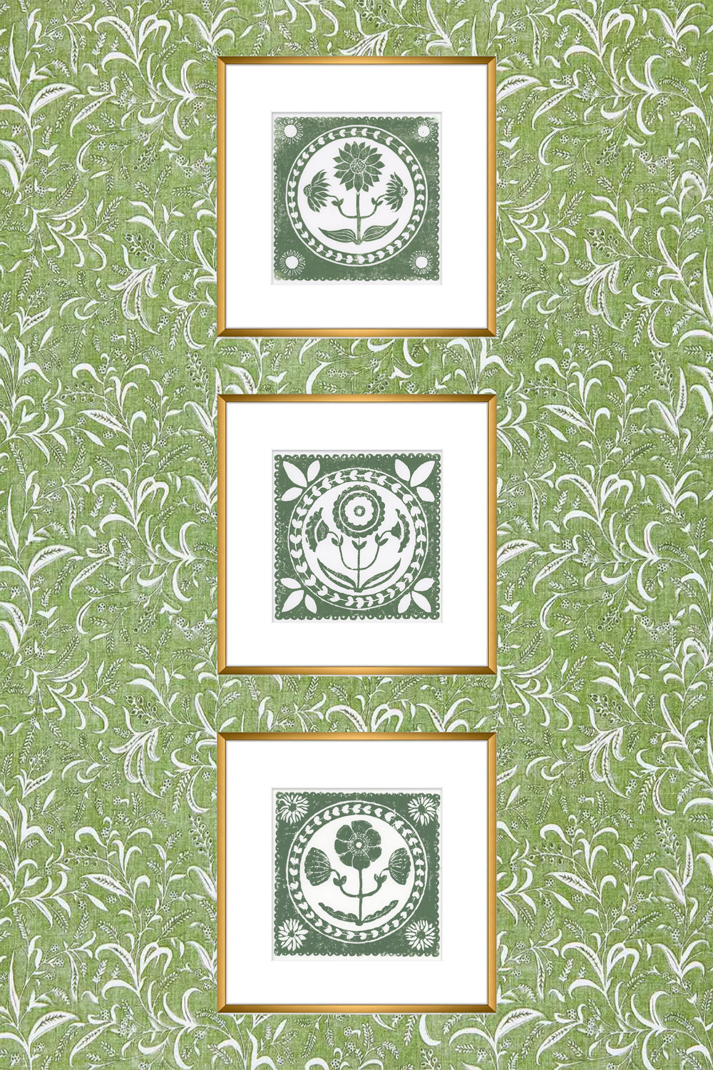 Three framed artworks with a floral design on a green patterned background