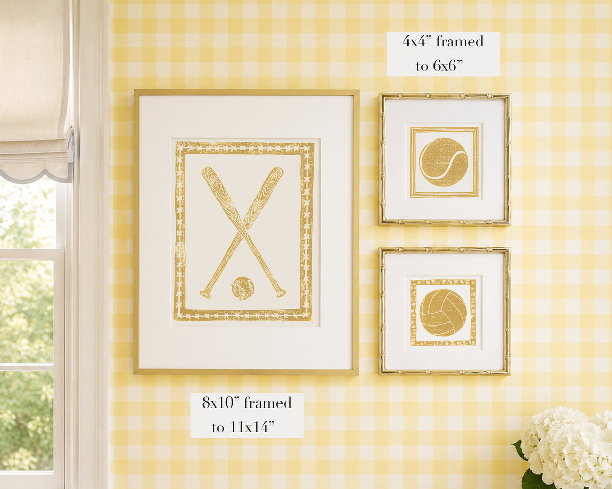 Framed yellow and white artwork on a yellow gingham wallpapered wall with window and floral decor.
