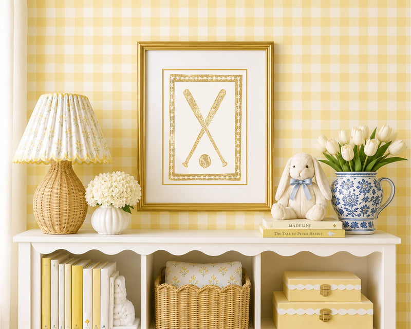 Decorative interior with a lamp, framed picture, and decorative items on a console table against a yellow checkered wall.