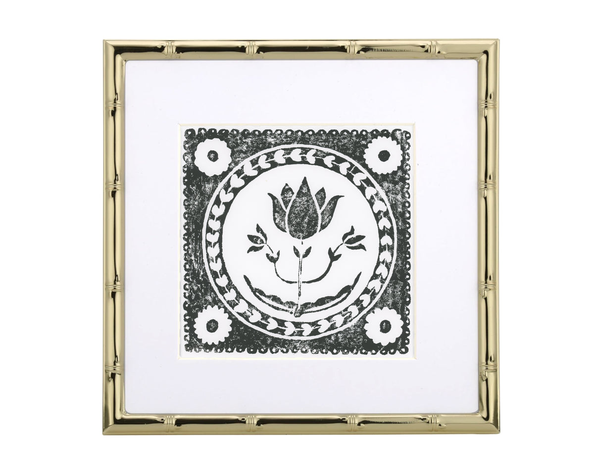 Decorative tile with floral design in a gold frame on a white background