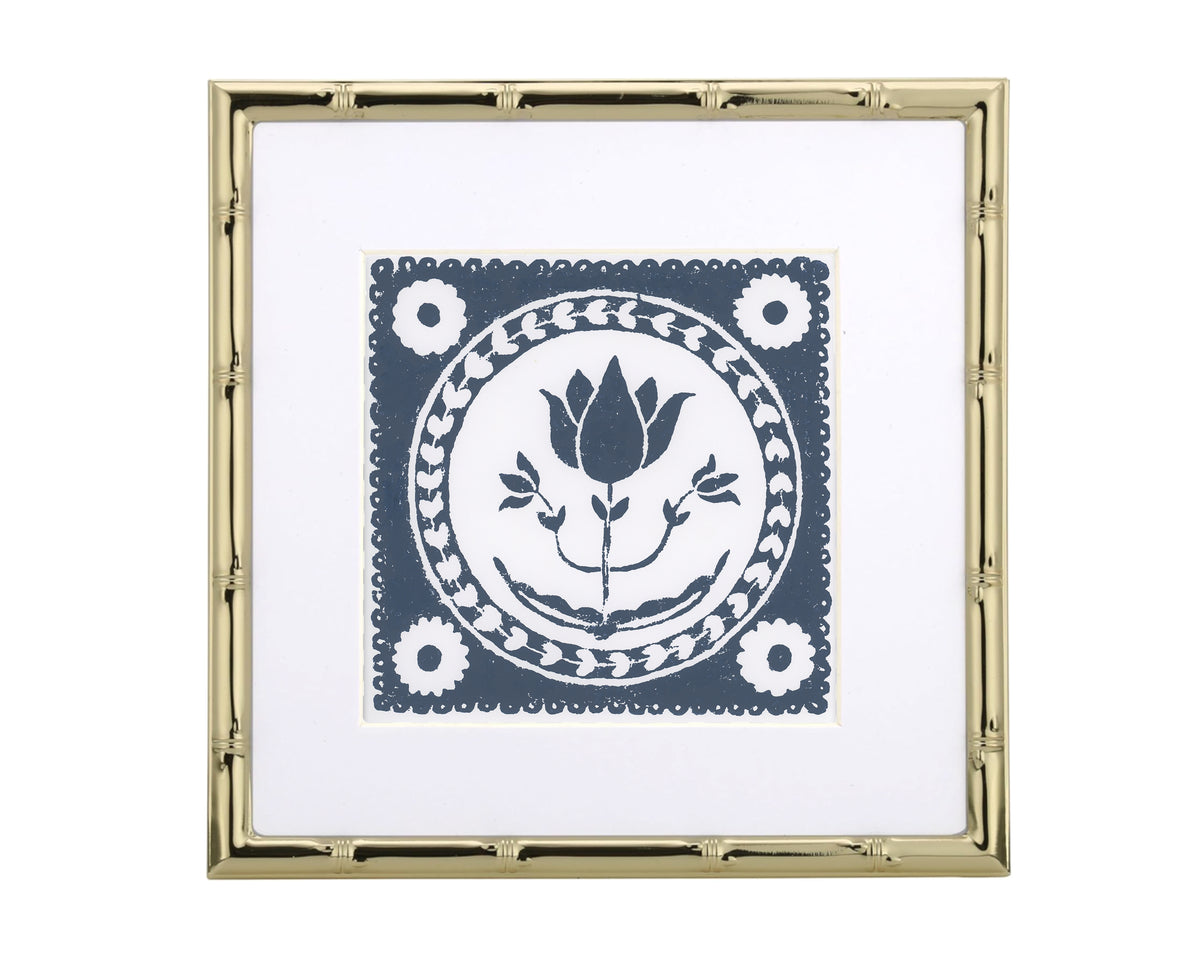 Decorative print with floral design in a gold frame on a white background