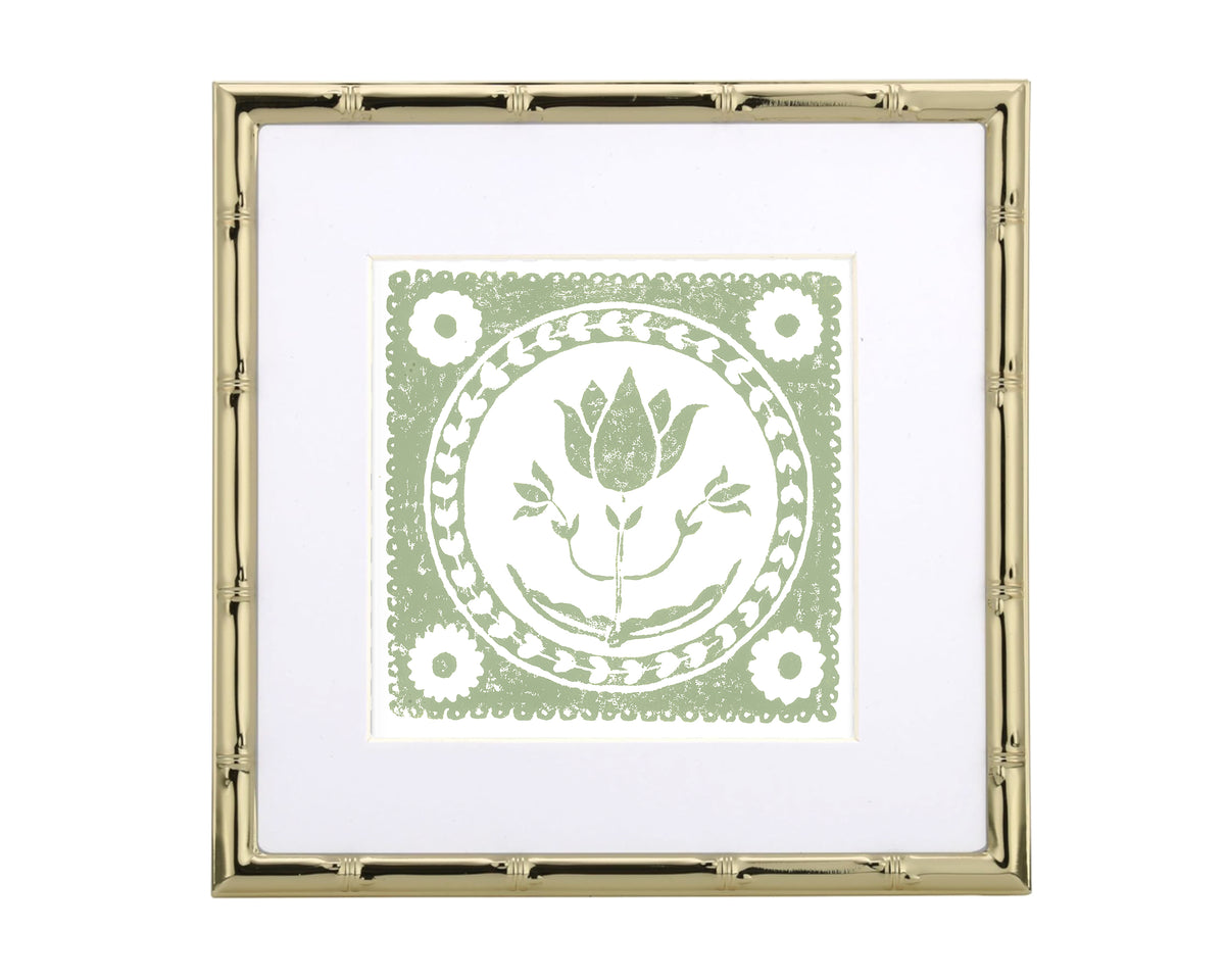 Framed artwork with a green floral design on a white background