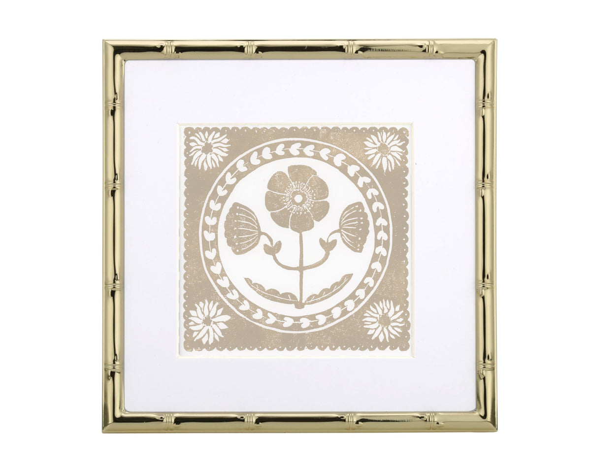 tan and white floral art print in a gold matted frame