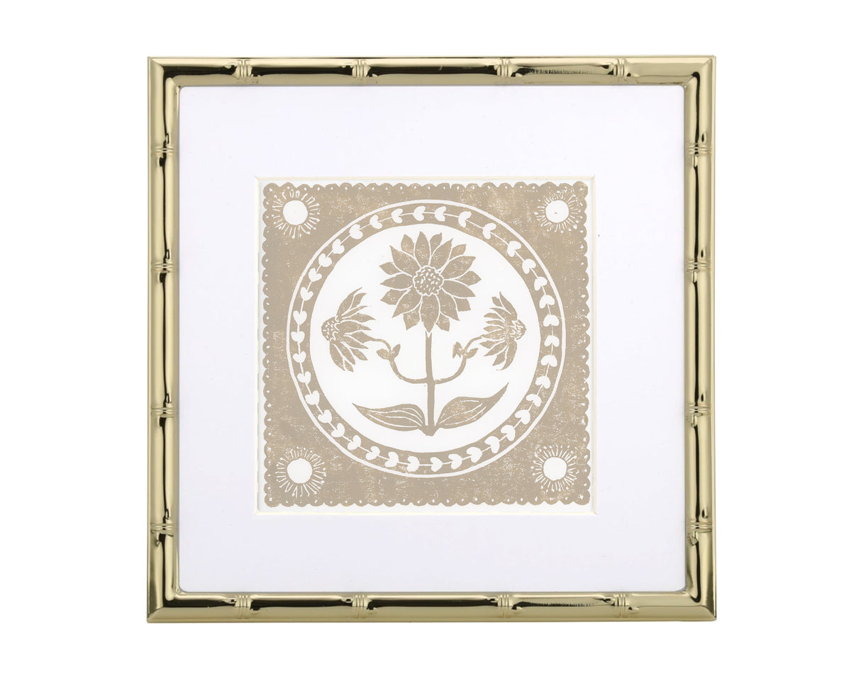 Decorative print with floral design inside a gold frame on a white background