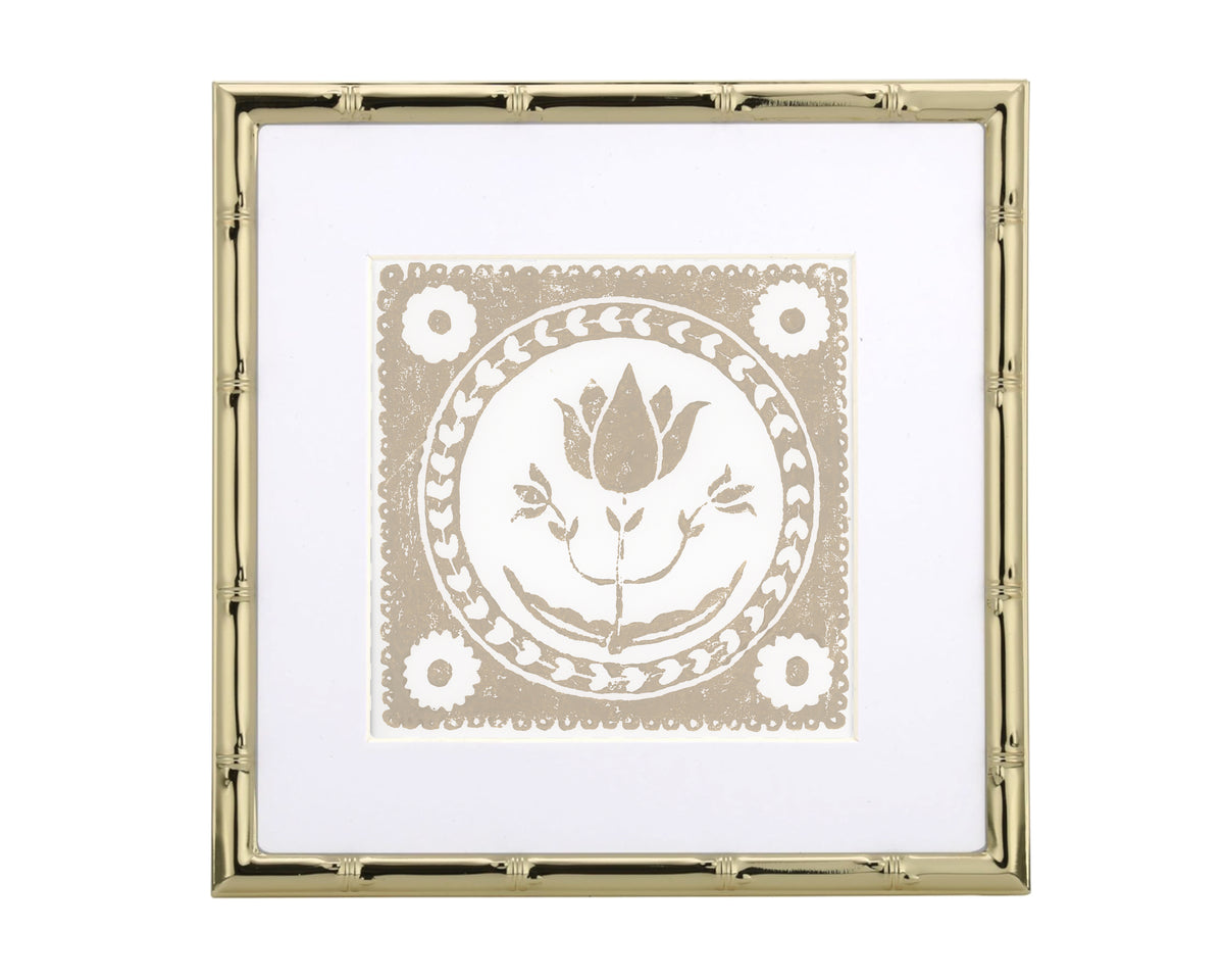 Decorative print with a floral design in a gold frame on a white background