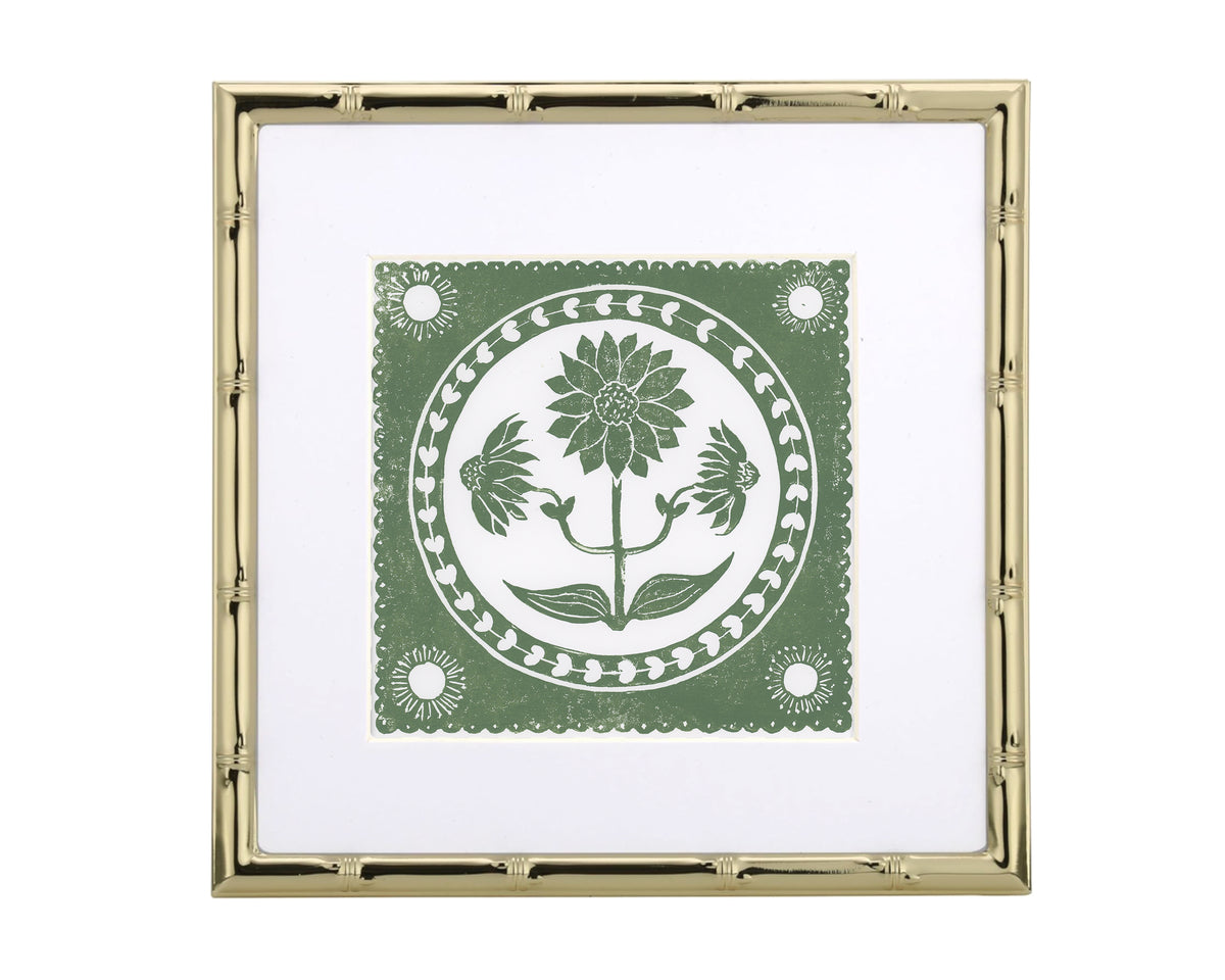 Decorative gold frame with a green and white floral design on a white background